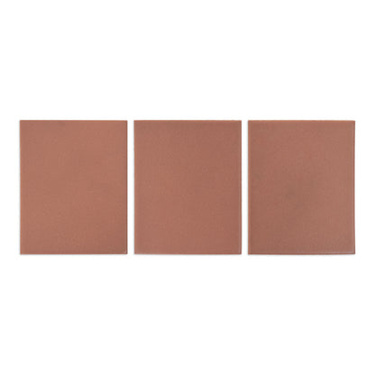 Three reddish-brown matte solid tiles by Clay Imports, arranged side-by-side on a white background.