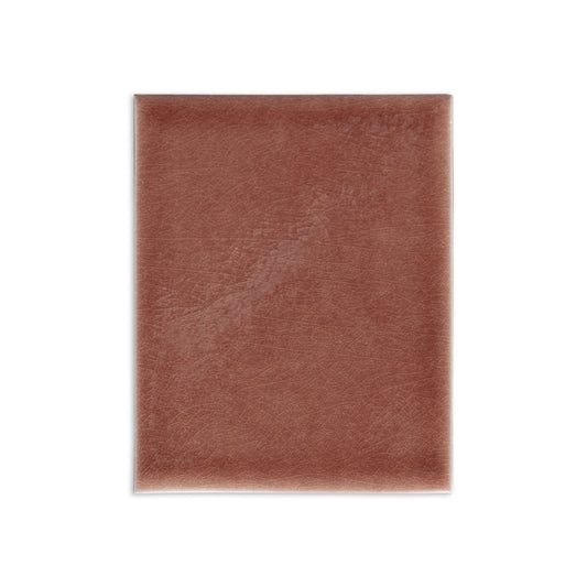 Brownish-red Tamarindo Gloss tile sample by Clay Imports, featuring a subtle crazed glaze texture.