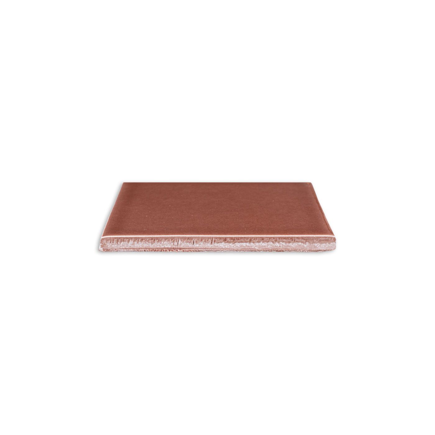 Tamarindo Gloss 4x5 solid tile by Clay Imports, reddish-brown with a glossy top and rough light underside, viewed from the side.