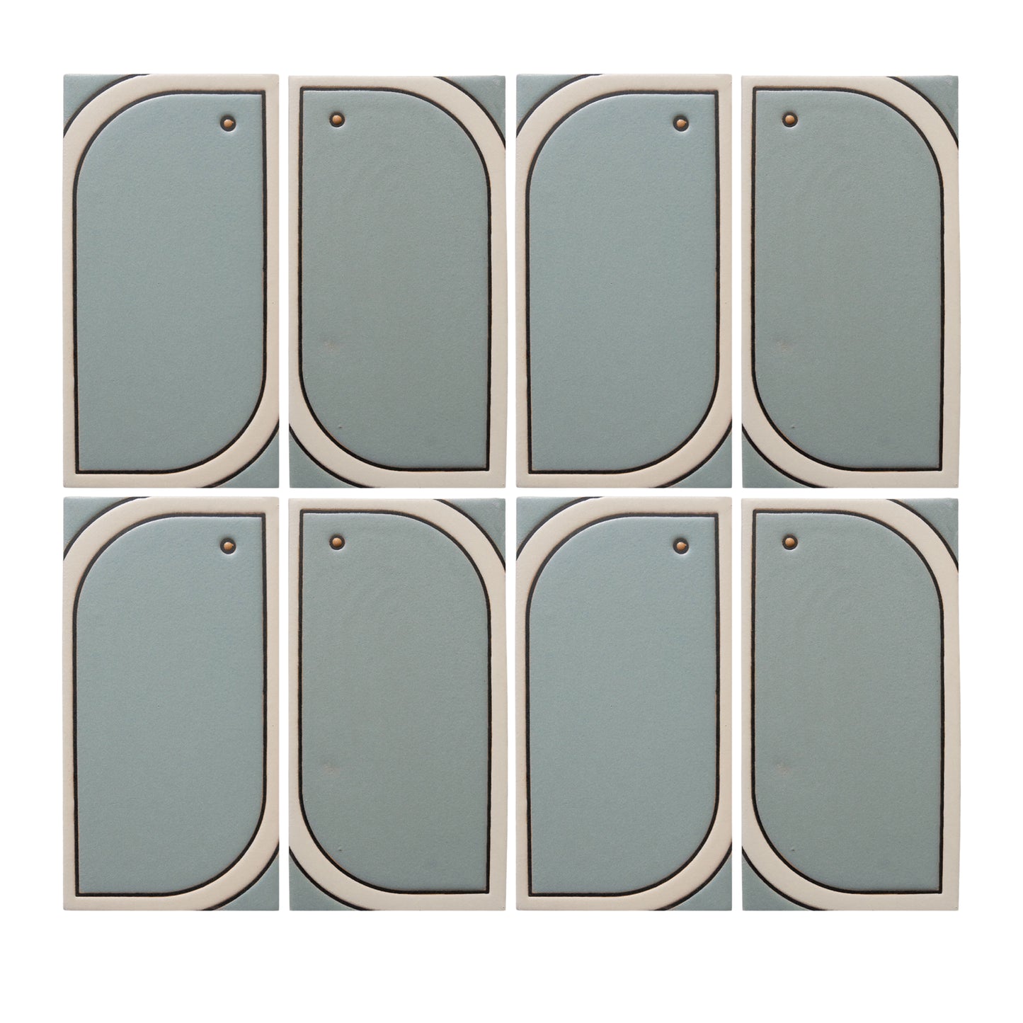 Eight light blue-green modular tiles by Clay Imports, with off-white curved frames and small brass studs, arranged in a grid.