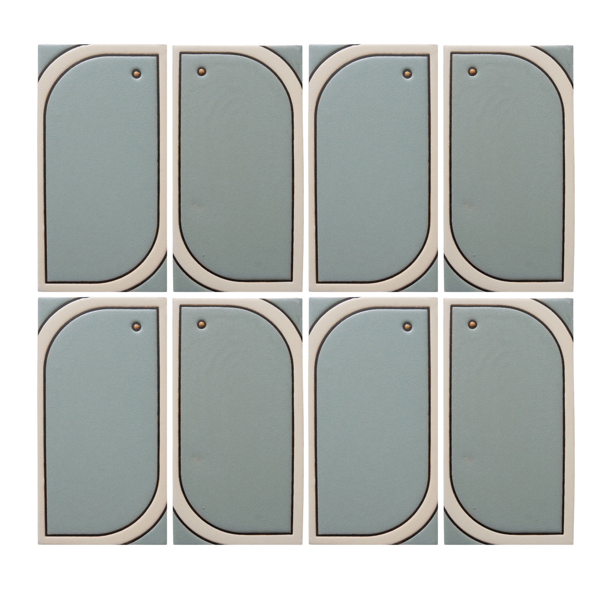 Eight light blue-green modular tiles by Clay Imports, with off-white curved frames and small brass studs, arranged in a grid.