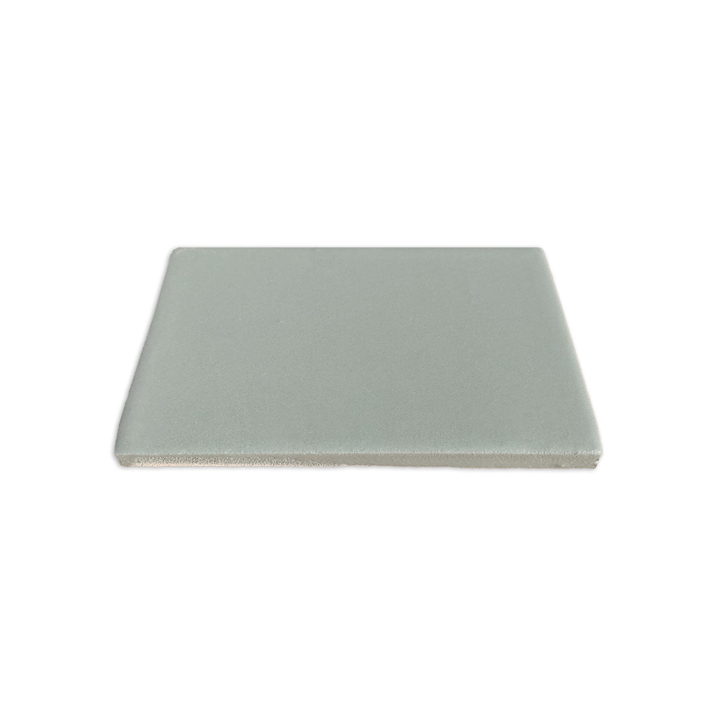 Rucksack green clay tile by Clay Imports, a square piece with a flat top and textured side edge.
