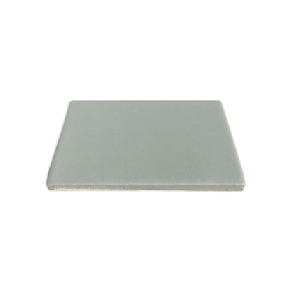 Rucksack green clay tile by Clay Imports, a square piece with a flat top and textured side edge.