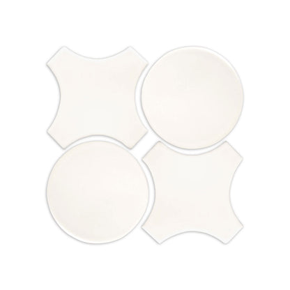 White clay tiles by Clay Imports, featuring two circular and two quatrefoil shapes arranged in a square.