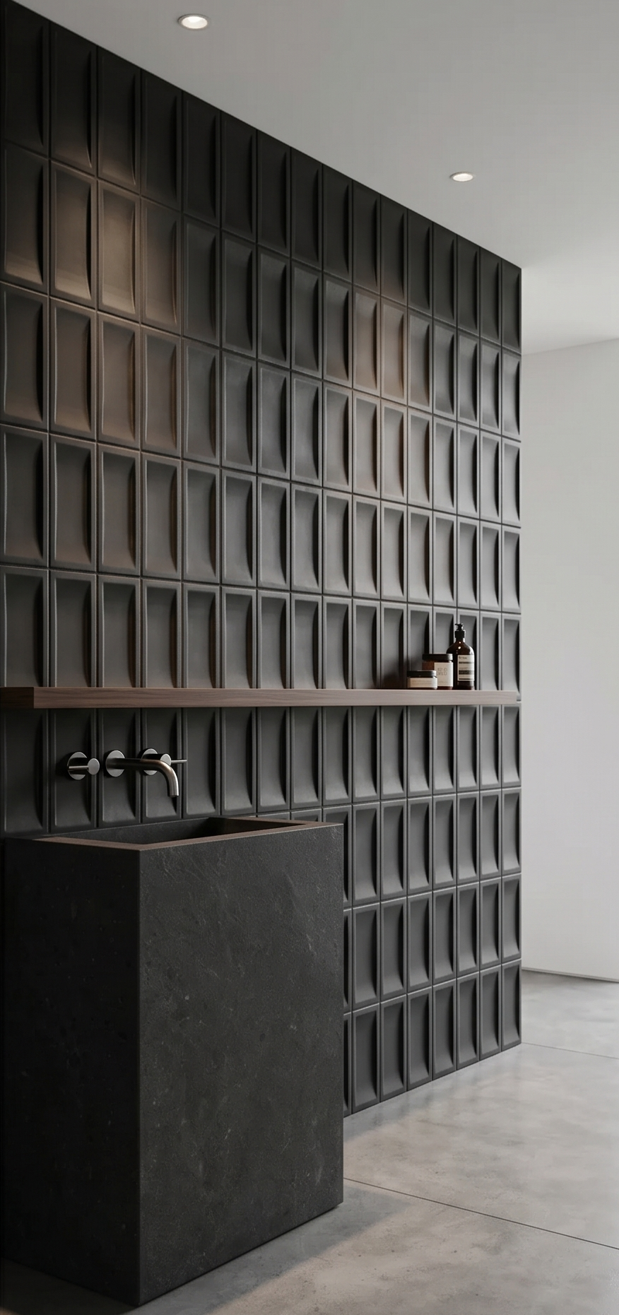 Black Suede Inversa Bota 4x8 tiles by Clay Imports featuring a unique embossed pattern on a bathroom wall with a dark stone sink.