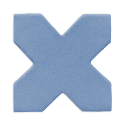 Denim blue X-shaped clay tile by Clay Imports with a subtle granular texture, casting a soft shadow.