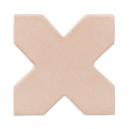 Sand-colored, cross-shaped clay tile by Clay Imports with rounded edges and a matte, textured finish.