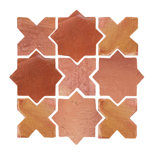 Earthy red-brown terracotta tiles by Clay Imports with an interlocking star and cross pattern and rustic texture.