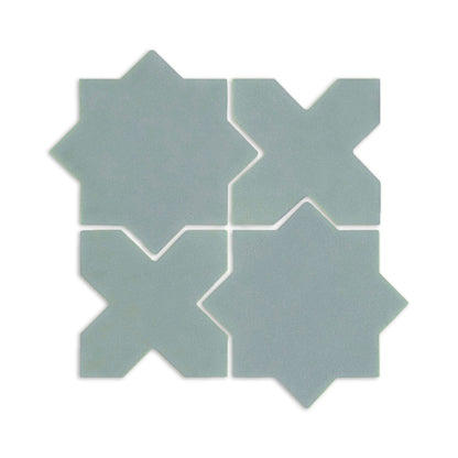 Light blue-green Star & Cross clay tiles by Clay Imports, arranged in a grid with a matte texture.