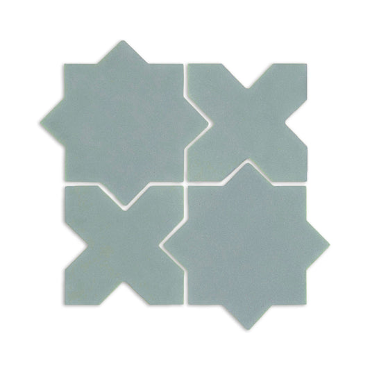 Light blue-green Star & Cross clay tiles by Clay Imports, arranged in a grid with a matte texture.
