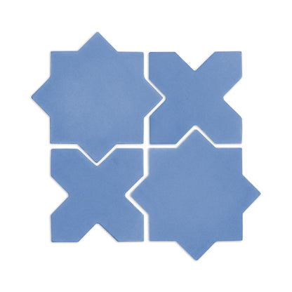 Denim blue star and cross clay tiles by Clay Imports, arranged in an interlocking square pattern on a white background.