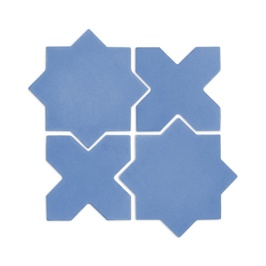 Denim blue star and cross clay tiles by Clay Imports, arranged in an interlocking square pattern on a white background.