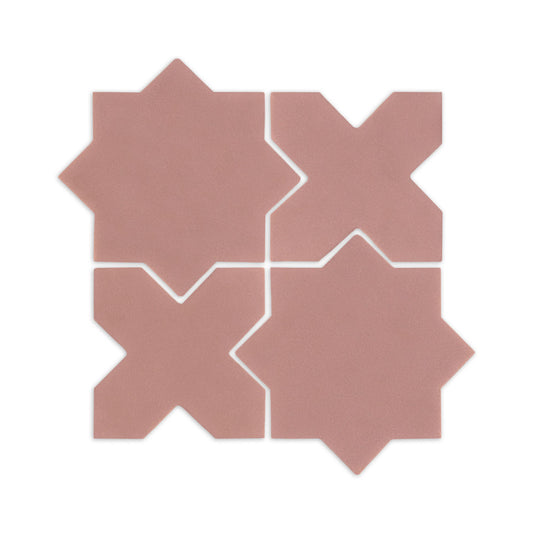 Four pink granite star and cross sample tiles by Clay Imports, showing their interlocking pattern and subtle texture.