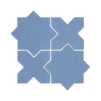 Denim blue star and cross clay tiles by Clay Imports, arranged in an interlocking square pattern on a white background.