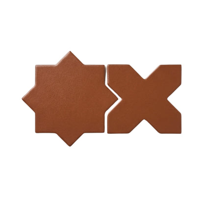 Cacao brown star and cross sample tiles by Clay Imports, two geometric pieces with a textured matte finish on white.
