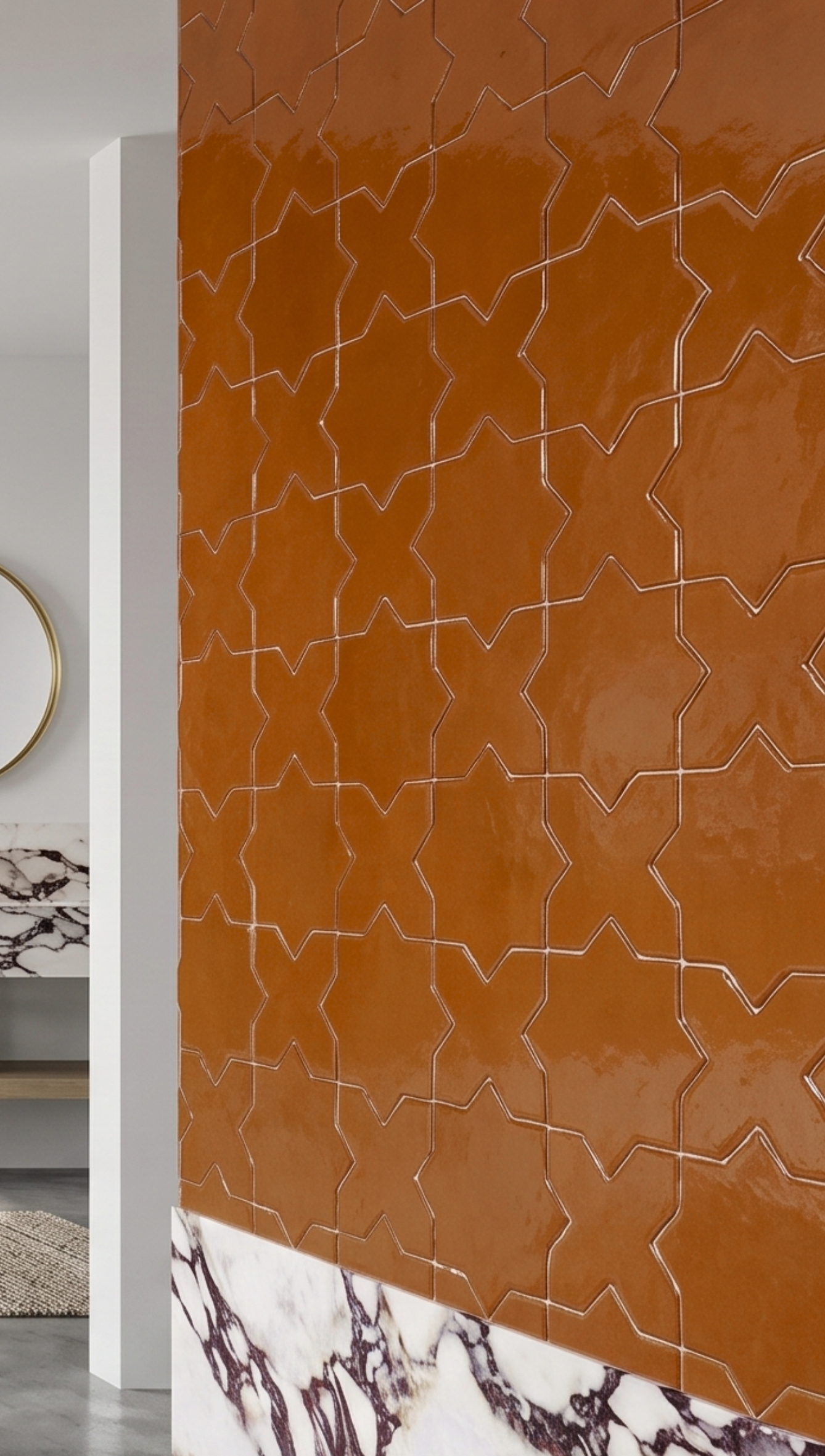 Cajeta Star & Cross solid tile by Clay Imports with a glossy finish on a wall above marble wainscoting.