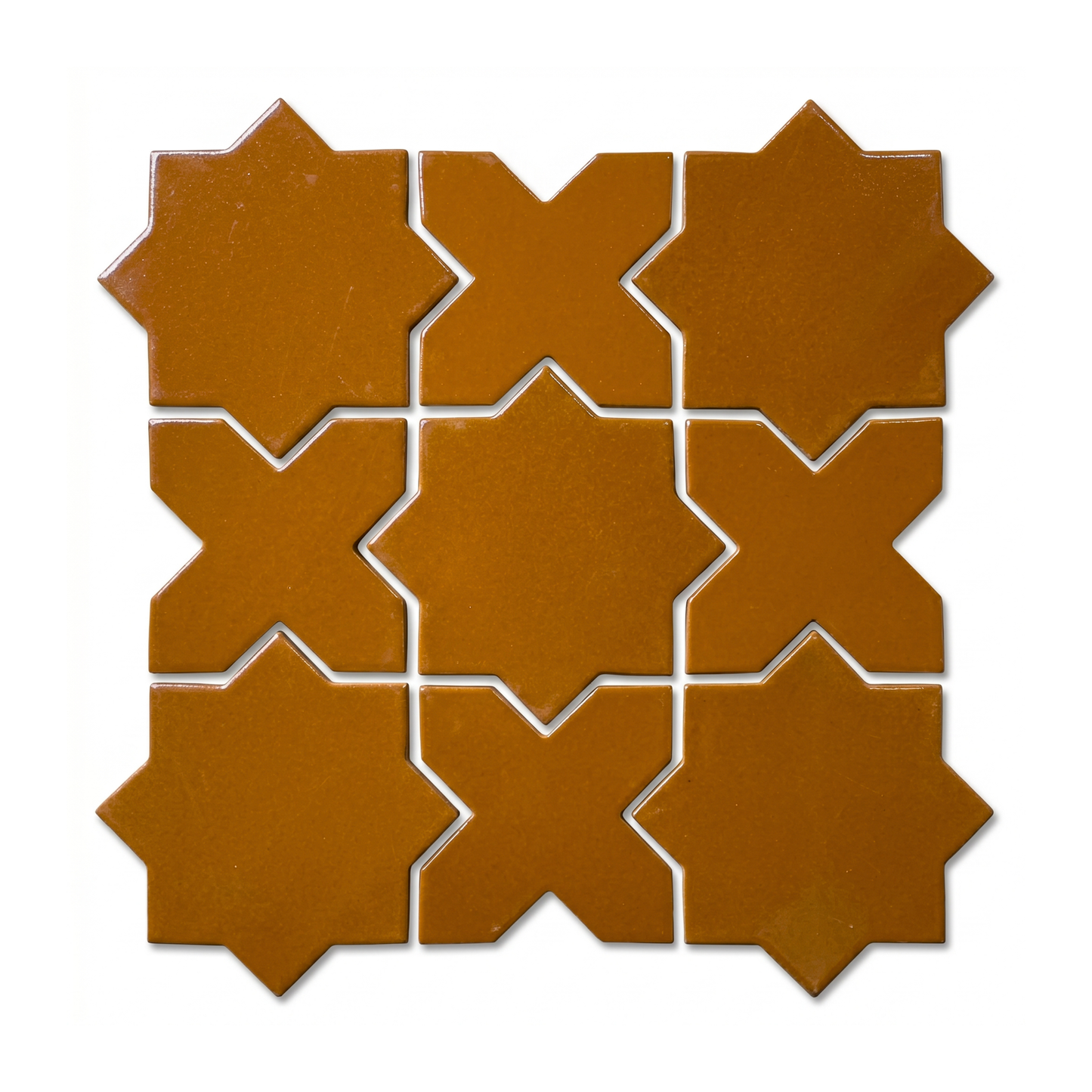 Cajeta Star and Cross tile by Clay Imports, arranged in a grid with glossy, rich brown interlocking geometric shapes.