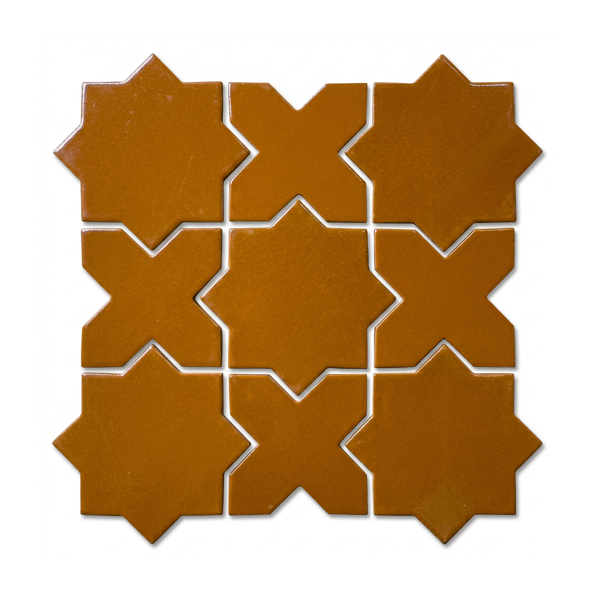 Cajeta Star and Cross tile by Clay Imports, arranged in a grid with glossy, rich brown interlocking geometric shapes.