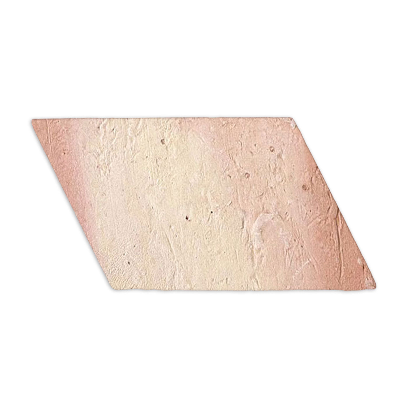 Antique matte terracotta tile in faded reddish-pink and cream by Clay Imports, with a textured parallelogram shape, left side view.
