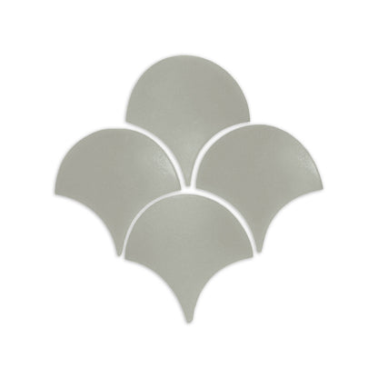 Agave green fan shape clay tile by Clay Imports, arranged in a scalloped pattern on a white background.