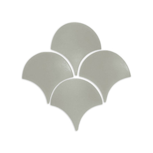 Agave green fan shape clay tile by Clay Imports, arranged in a scalloped pattern on a white background.