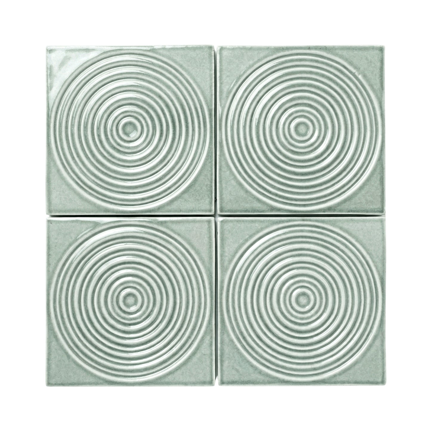 Four Aurora Arctic Gloss tiles by Clay Imports, featuring raised concentric circle patterns.