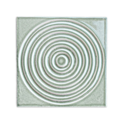 Square Aurora Arctic tile by Clay Imports with glossy, embossed concentric ripples in white, blue, and pink.