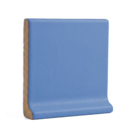 Denim blue cove base tile trim by Clay Imports, a single piece with a smooth, curved base.