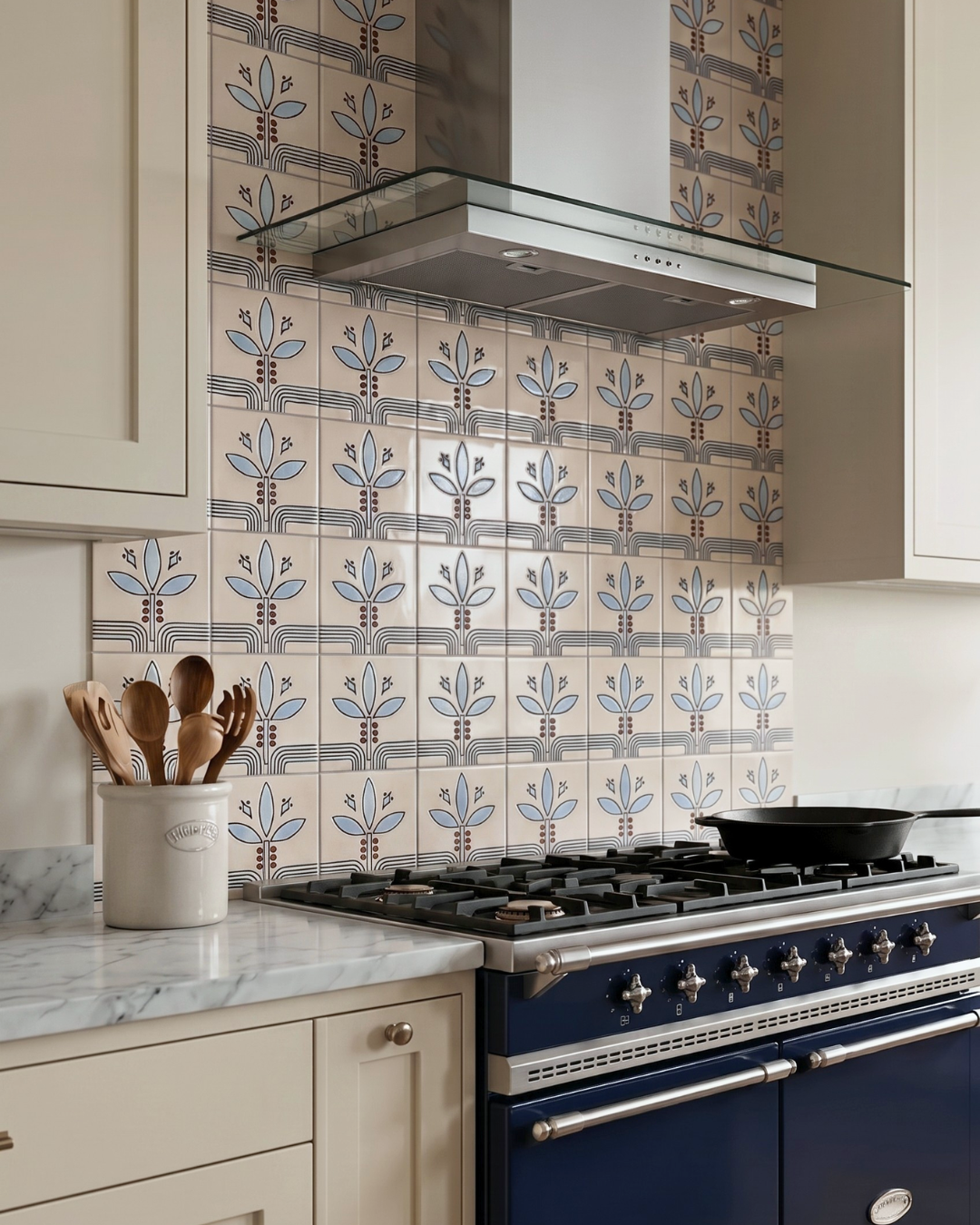 Kitchen with blue stove and decorative tile backsplash