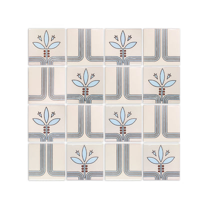 Cream pattern tile by Clay Imports with a repeating art deco inspired design of blue leaves, red berries, and interconnecting dark lines.