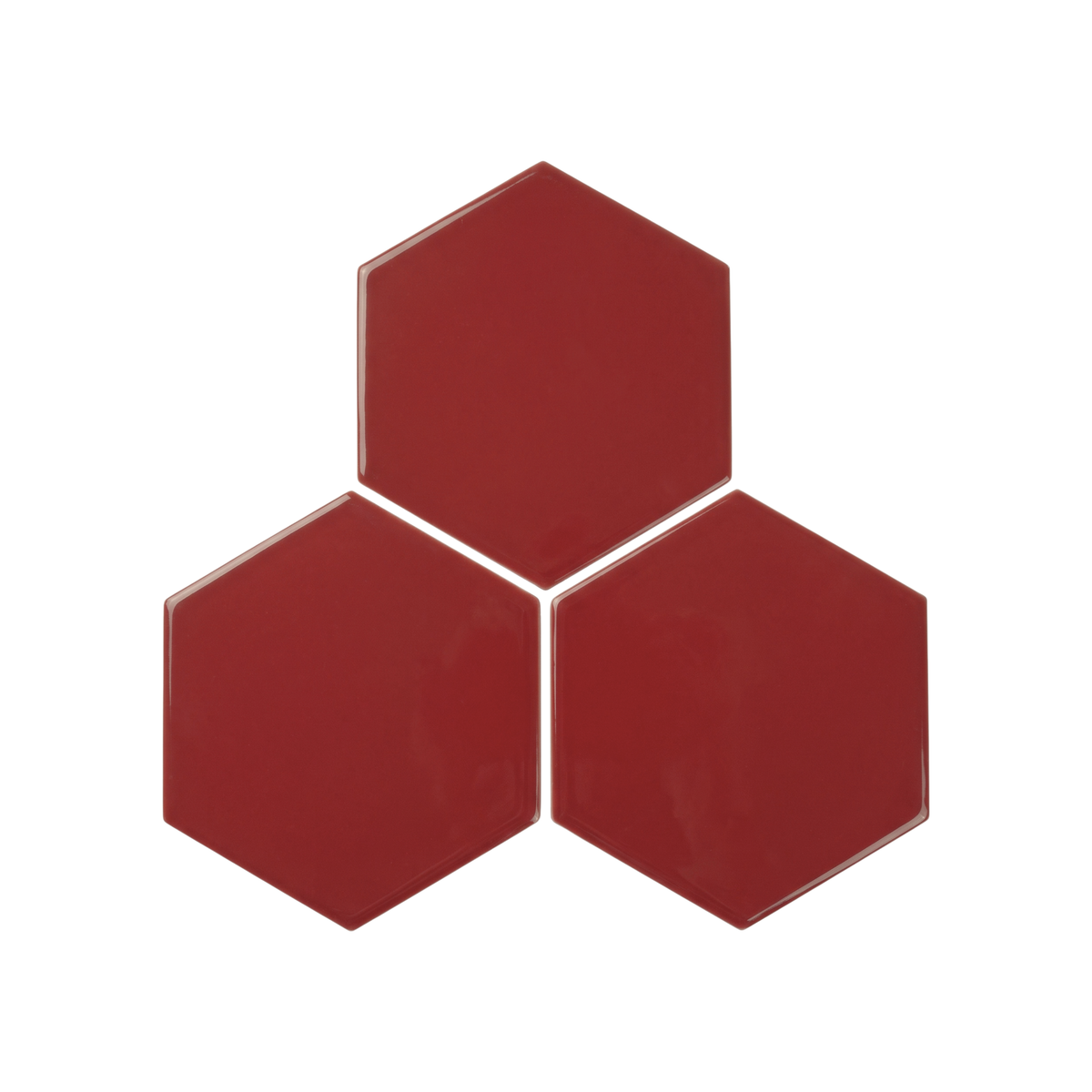Three glossy hexagonal tiles in a deep red color, arranged in a triangular cluster on a plain white background.