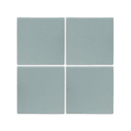 Four light blue-grey 6x6 clay tiles by Clay Imports, arranged in a grid with a subtle speckled matte finish.