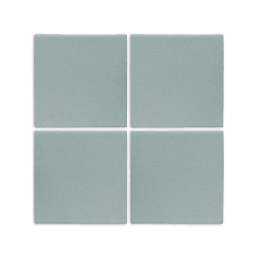 Four light blue-grey 6x6 clay tiles by Clay Imports, arranged in a grid with a subtle speckled matte finish.