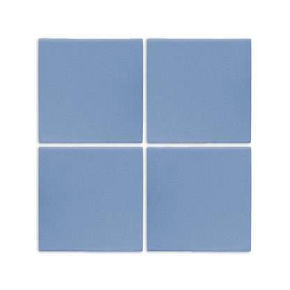 Denim blue square clay tile from Clay Imports, with a granular matte texture, arranged in a 2x2 grid.