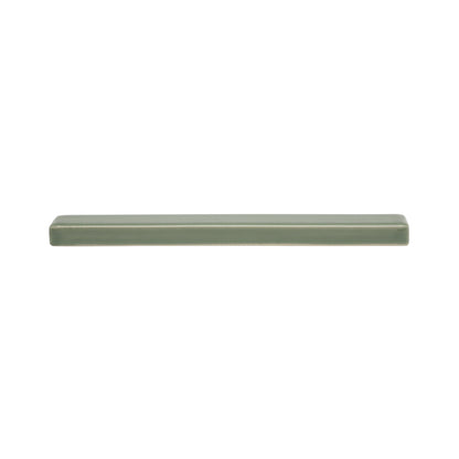 Sage green solid tile box liner by Clay Imports with a smooth glazed finish, shown horizontally in a side view.