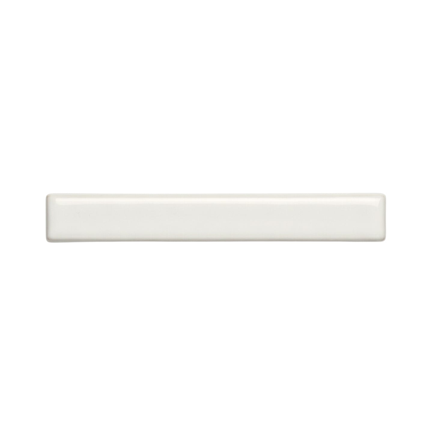 A rectangular off-white solid tile by Clay Imports, with rounded edges and a glossy, smooth finish.