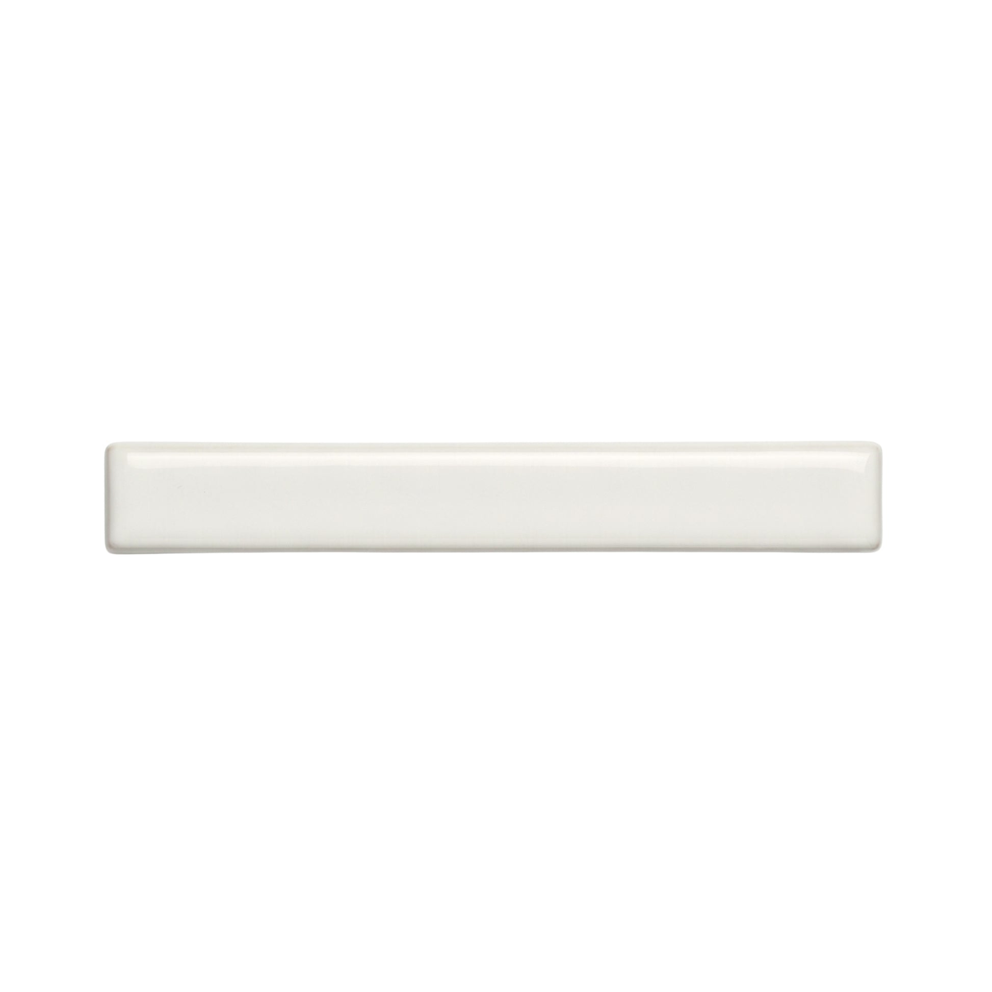 A rectangular off-white solid tile by Clay Imports, with rounded edges and a glossy, smooth finish.