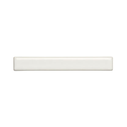 A rectangular off-white solid tile by Clay Imports, with rounded edges and a glossy, smooth finish.