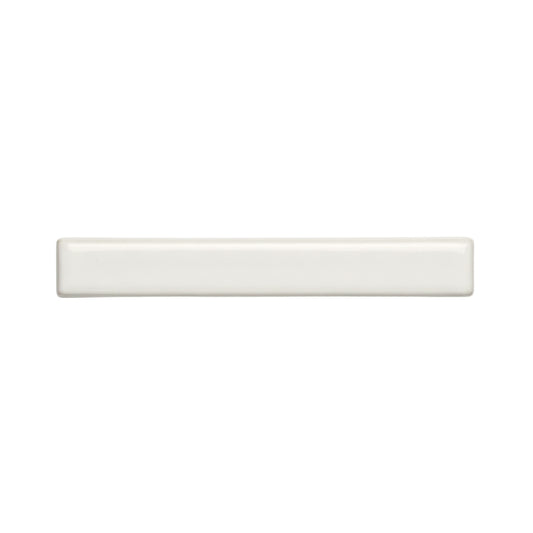 A rectangular off-white solid tile by Clay Imports, with rounded edges and a glossy, smooth finish.