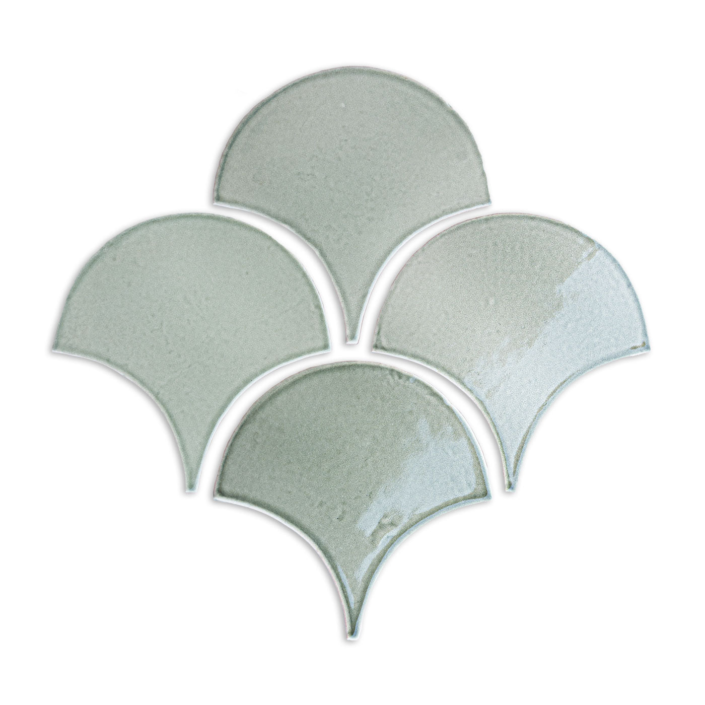 Light green ceramic fan tiles by Clay Imports, arranged in an interlocking pattern with a glossy finish.