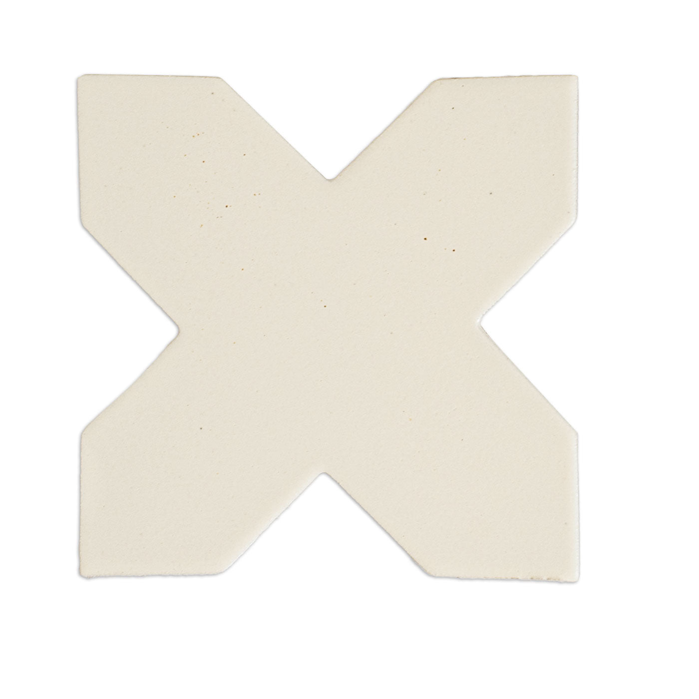 Mexican vanilla cross-shaped solid tile from Clay Imports, featuring a subtle matte texture and rounded edges.