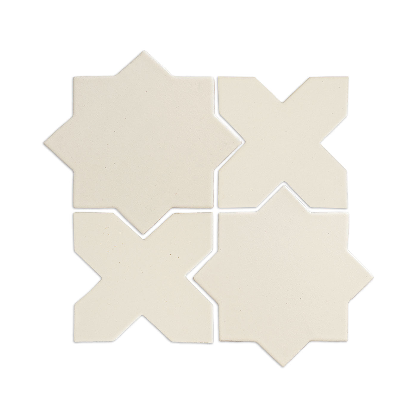 Creamy off-white star-shaped tile by Clay Imports, arranged with X-shaped companion tiles in a geometric pattern.