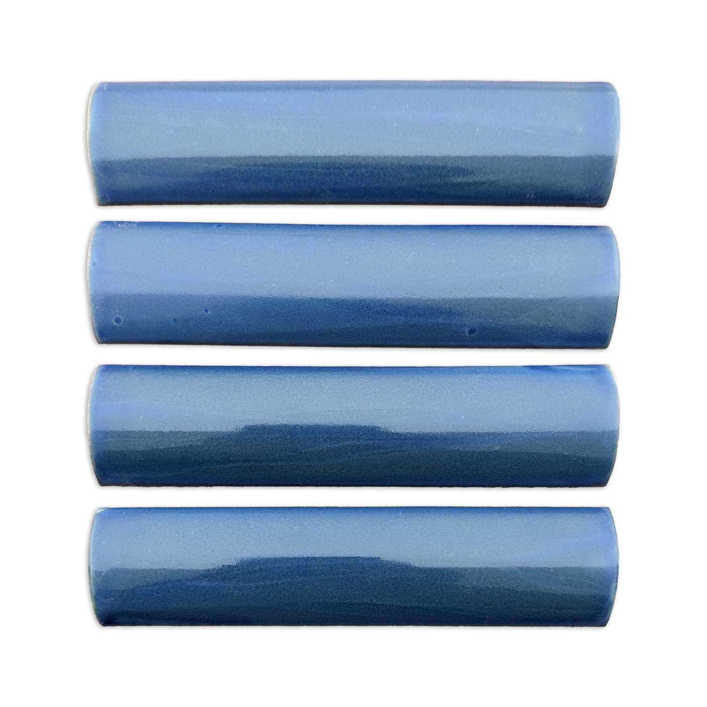 Four blue glazed Stardust quarter round tiles by Clay Imports, with a glossy, light to dark blue gradient.
