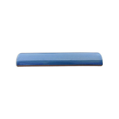Blue Stardust Quarter Round solid tile by Clay Imports, a glazed blue piece with a rounded edge and visible clay base.