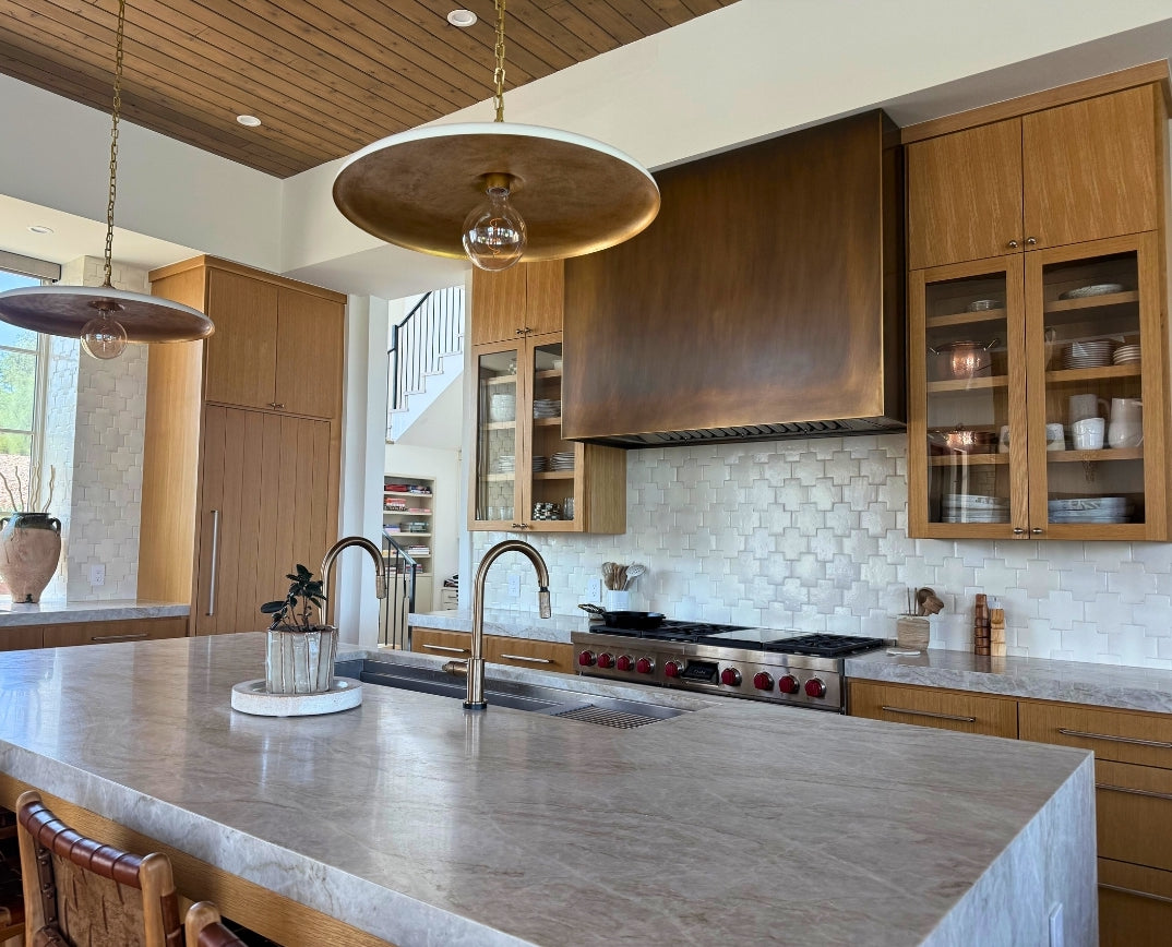 Glazed white terracotta tiles by Clay Imports, featuring a subtle Swiss Cross pattern as a kitchen backsplash.