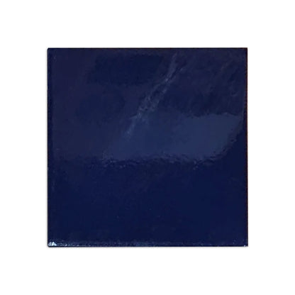 Dark blue square clay tile by Clay Imports with a glossy, reflective surface and slightly textured appearance.