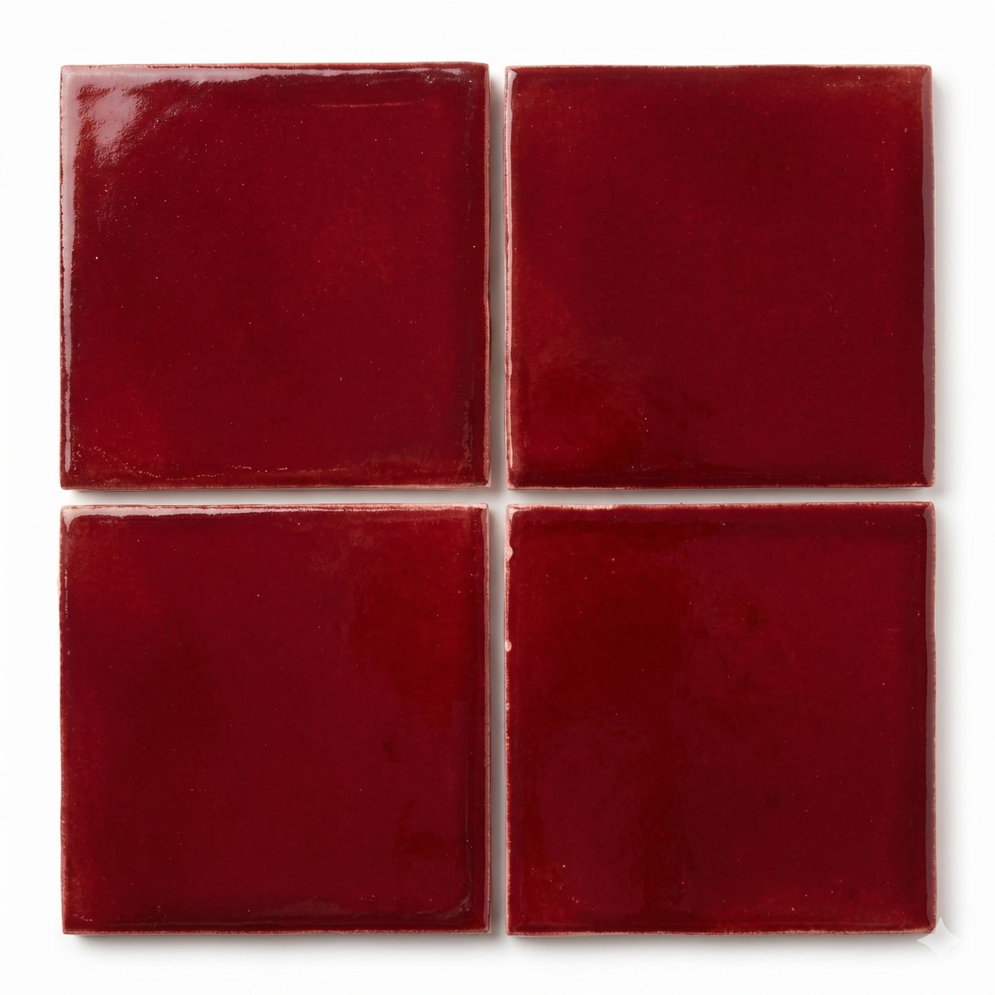 Oxblood clay tiles by Clay Imports, arranged in a grid with a glossy finish and subtle texture.