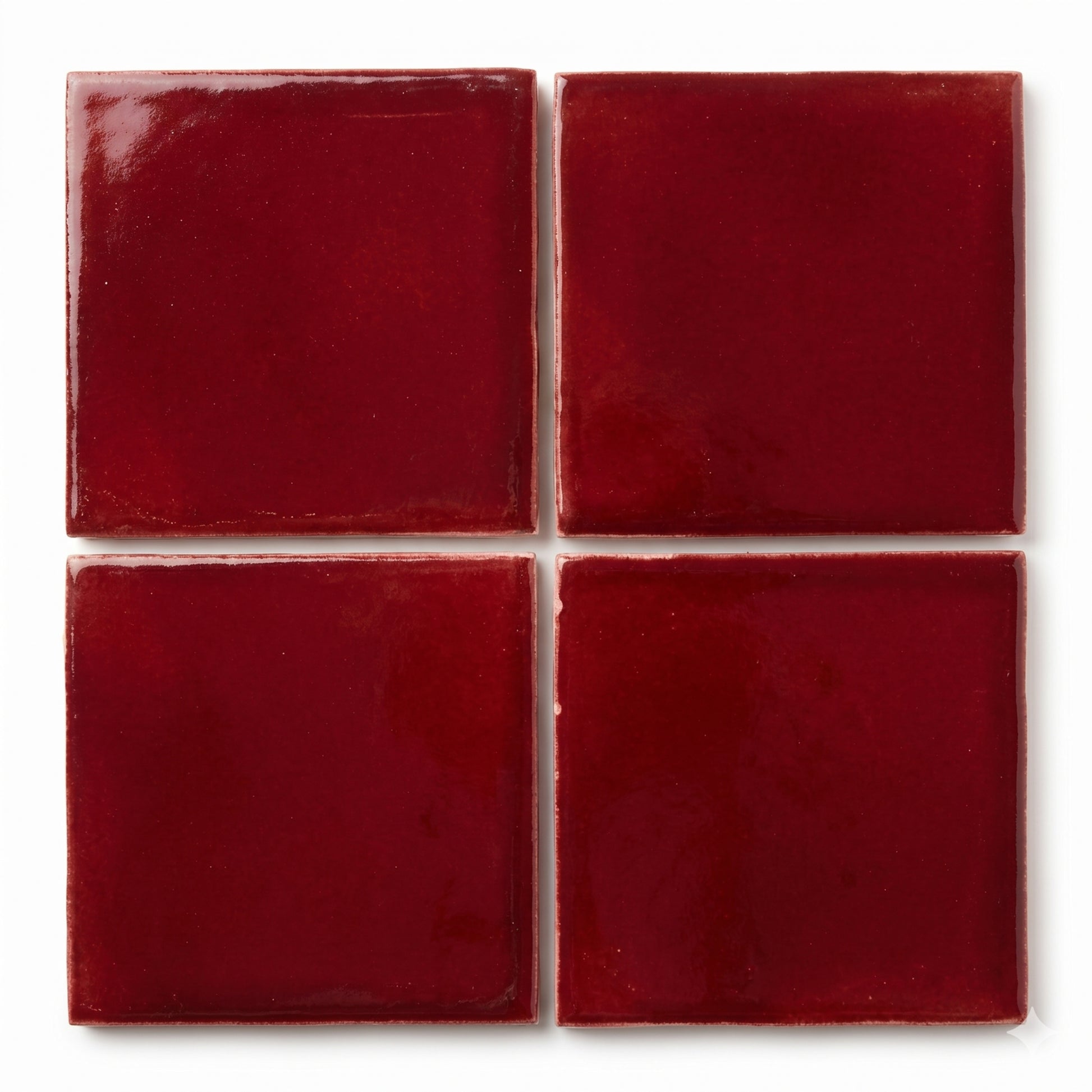 Oxblood clay tiles by Clay Imports, arranged in a grid with a glossy finish and subtle texture.