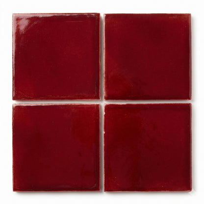 Oxblood clay tiles by Clay Imports, arranged in a grid with a glossy finish and subtle texture.