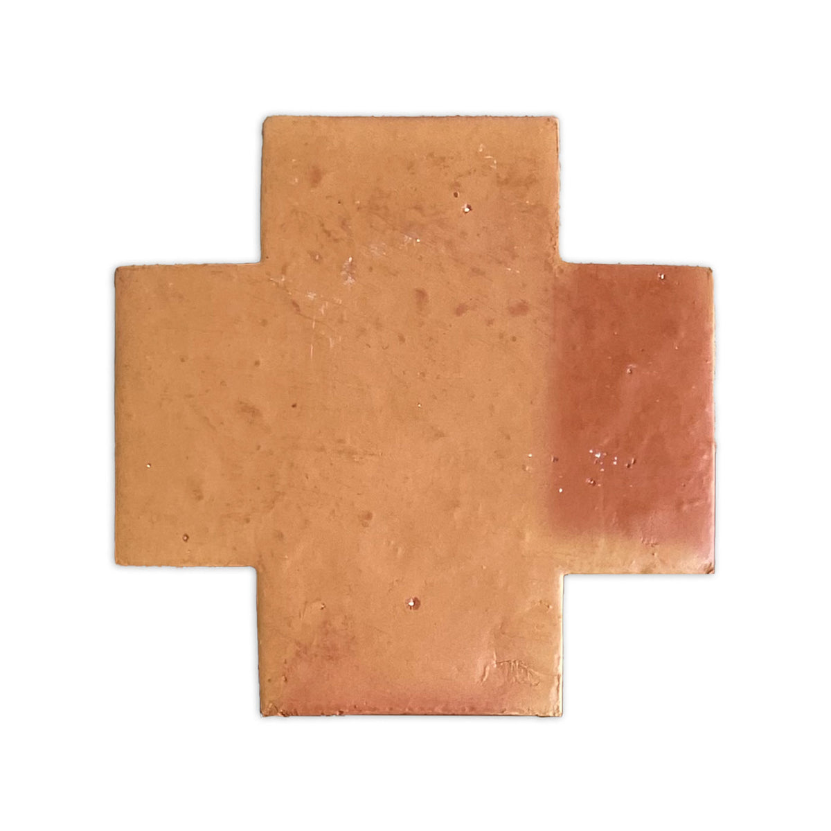 A reddish-brown Swiss Cross sample tile with a smooth, satin finish by Clay Imports, showing subtle color variation and a darker right arm.